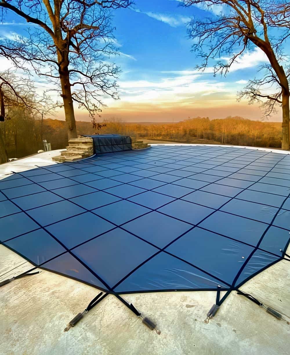Inground pool safety cover on an Oklahoma pool at sunset